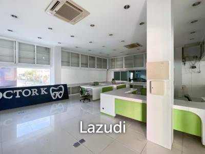 Prime Corner Showroom for Car Dealership or Business with Heavy-Duty Lift and Ample Parking