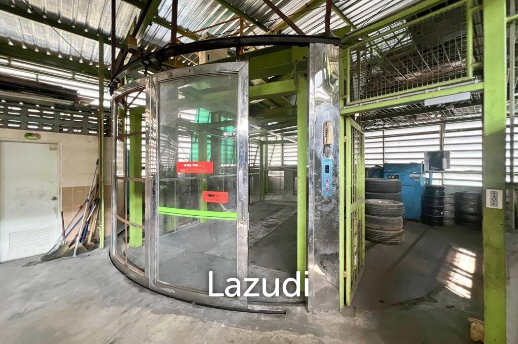 Prime Corner Showroom for Car Dealership or Business with Heavy-Duty Lift and Ample Parking