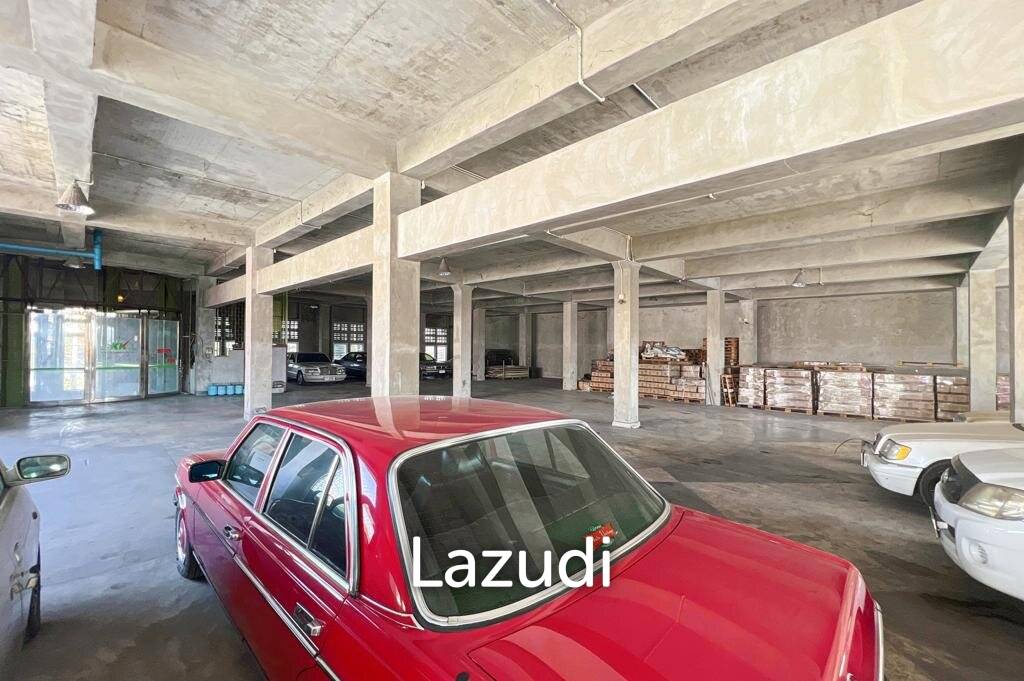 Prime Corner Showroom for Car Dealership or Business with Heavy-Duty Lift and Ample Parking