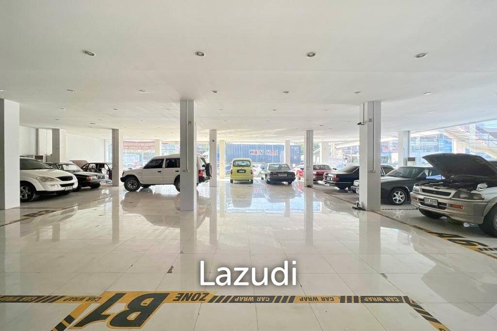 Prime Corner Showroom for Car Dealership or Business with Heavy-Duty Lift and Ample Parking