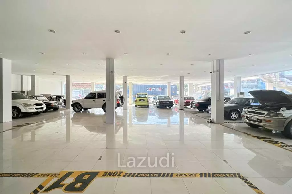Prime Corner Showroom for Car Dealership or Business with Heavy-Duty Lift and Ample Parking