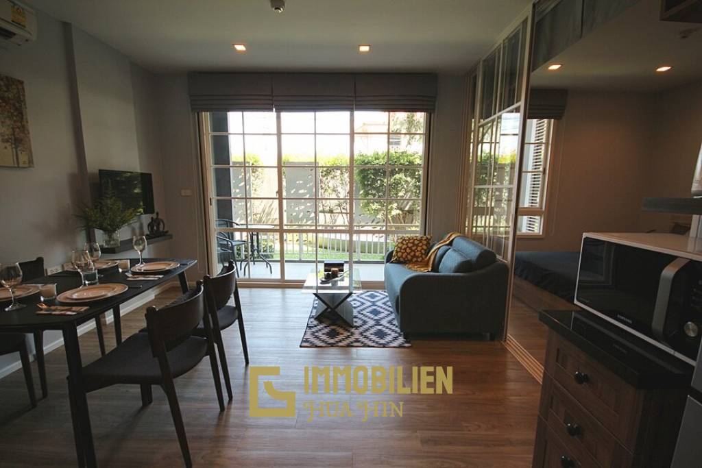 Autumn Condominium: 1 Schlafzimmer-Eigentumswohnung im Erdgeschoss mit Gartenblick