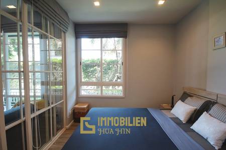 Autumn Condominium: 1 Schlafzimmer-Eigentumswohnung im Erdgeschoss mit Gartenblick