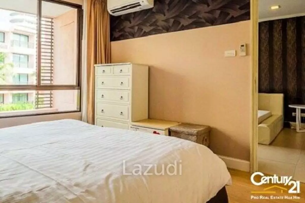 1 Bed Condo with Pool View in Town