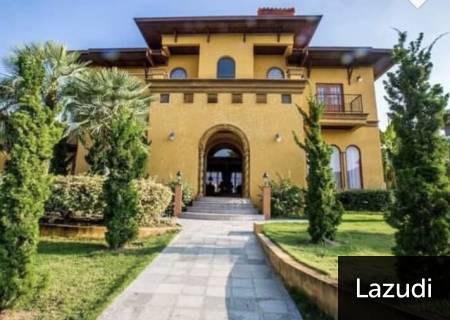 Front exterior view of a two-story house with landscaped garden