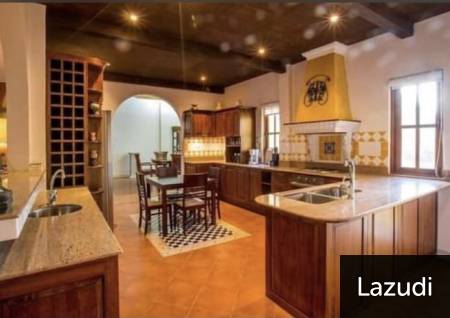 Spacious kitchen with island countertop and dining area