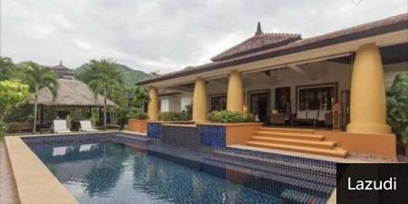 Outdoor swimming pool adjacent to a covered patio area