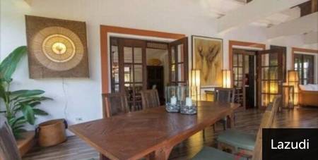 Dining area with wooden table and chairs in residential interior