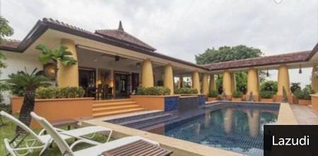 Outdoor view of property with covered patio and swimming pool