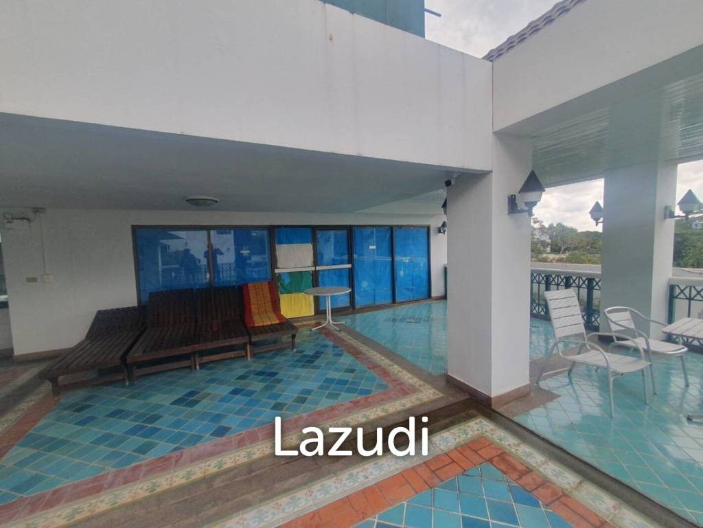 Penthouse unit in front of swimming pool