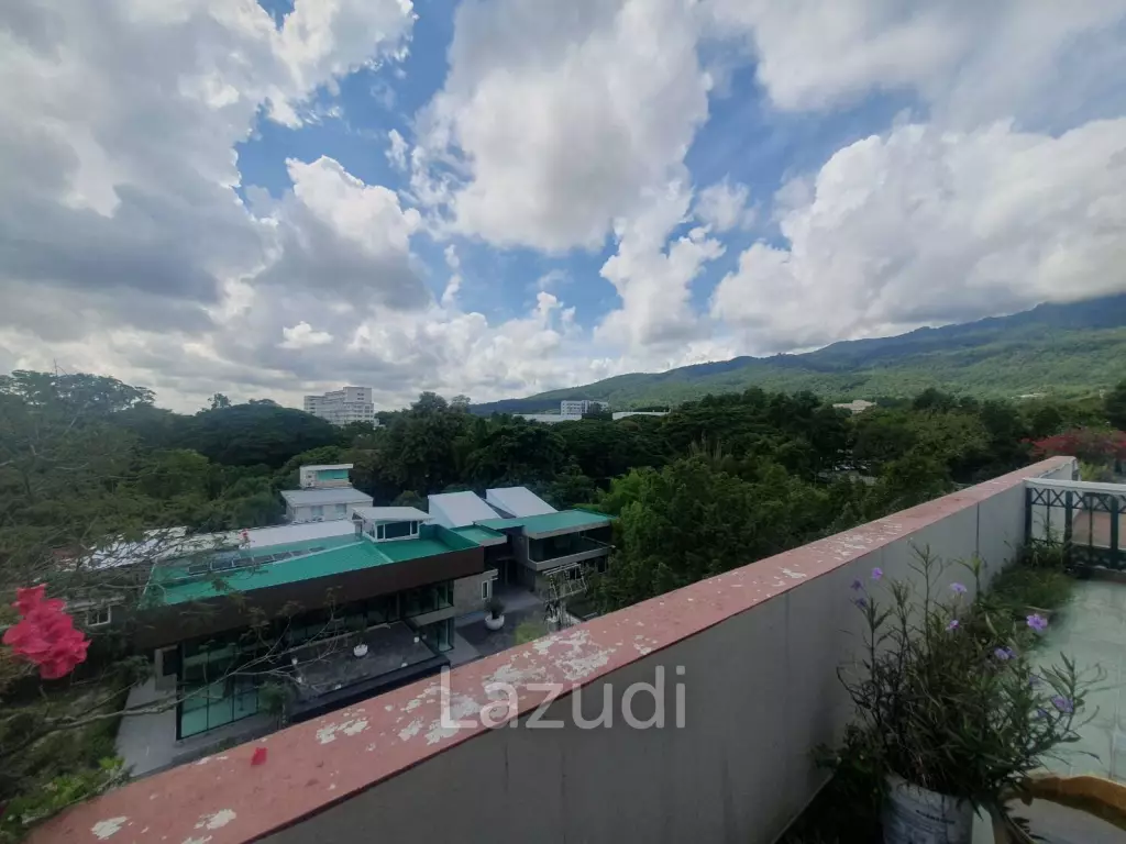 Penthouse unit in front of swimming pool
