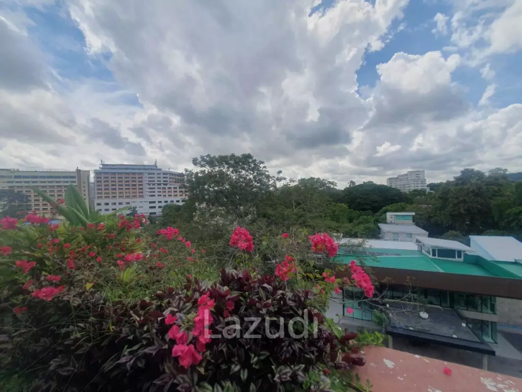 Penthouse unit in front of swimming pool