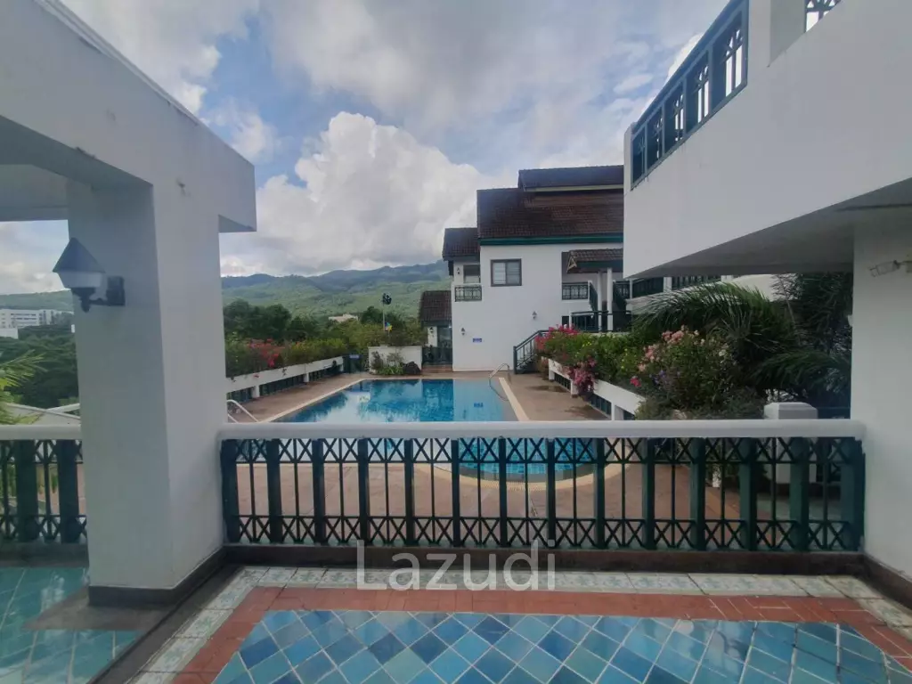 Penthouse unit in front of swimming pool