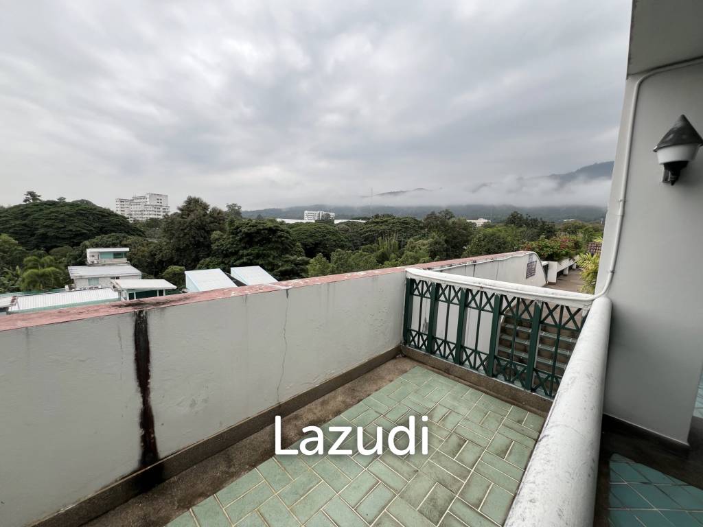 Penthouse unit in front of swimming pool