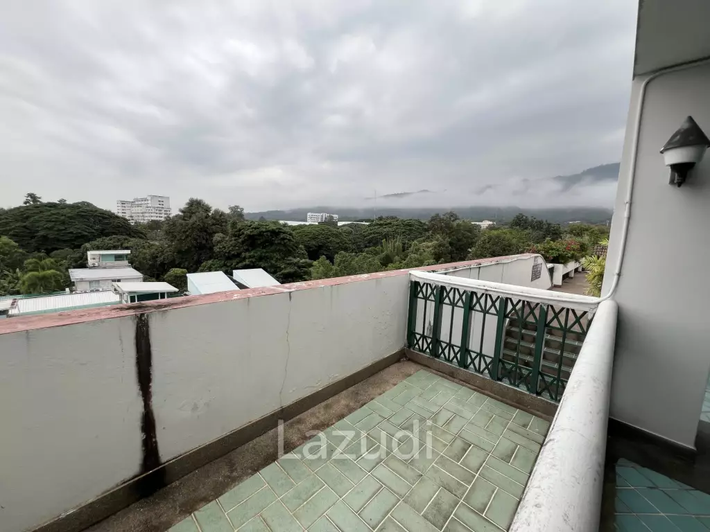Penthouse unit in front of swimming pool