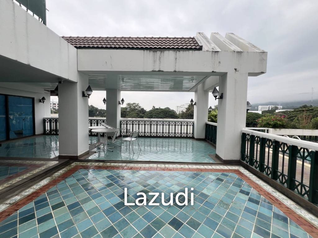 Penthouse unit in front of swimming pool