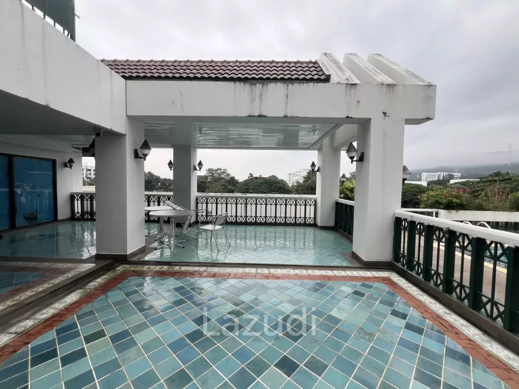 Penthouse unit in front of swimming pool
