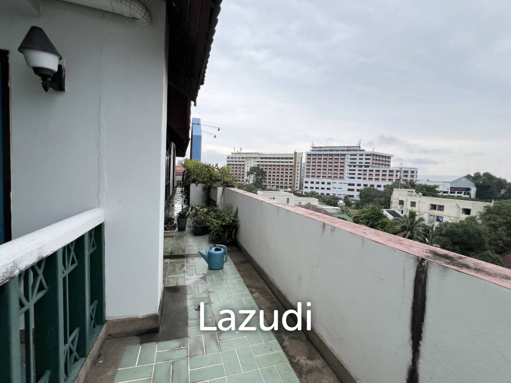 Penthouse unit in front of swimming pool