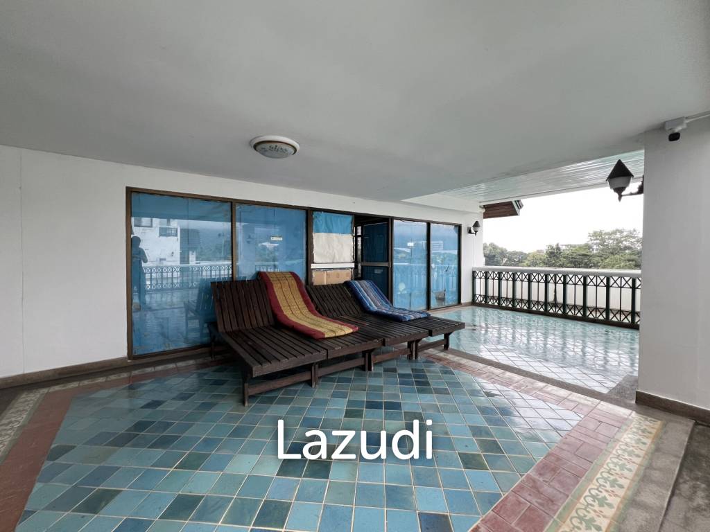 Penthouse unit in front of swimming pool