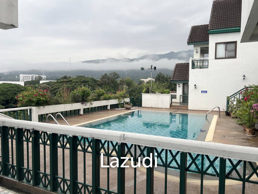 Penthouse unit in front of swimming pool