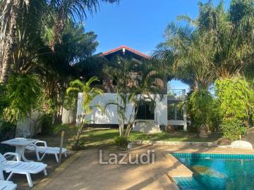 Serene Luxury Unveiled: 300 sqm Villa on 1 Rai with Rock-Embedded Pool and Picturesque Park Views