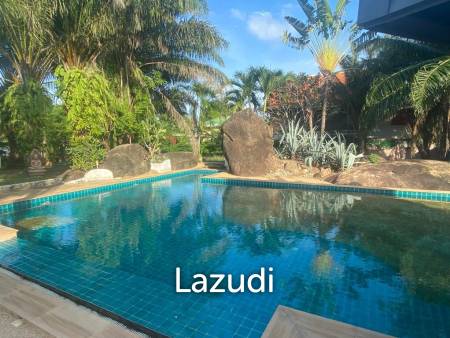 Serene Luxury Unveiled: 400 sqm Villa on 1600 sqm  with Rock-Embedded Pool and Picturesque Park Views