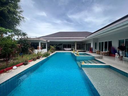 Outdoor swimming pool area adjacent to residential building