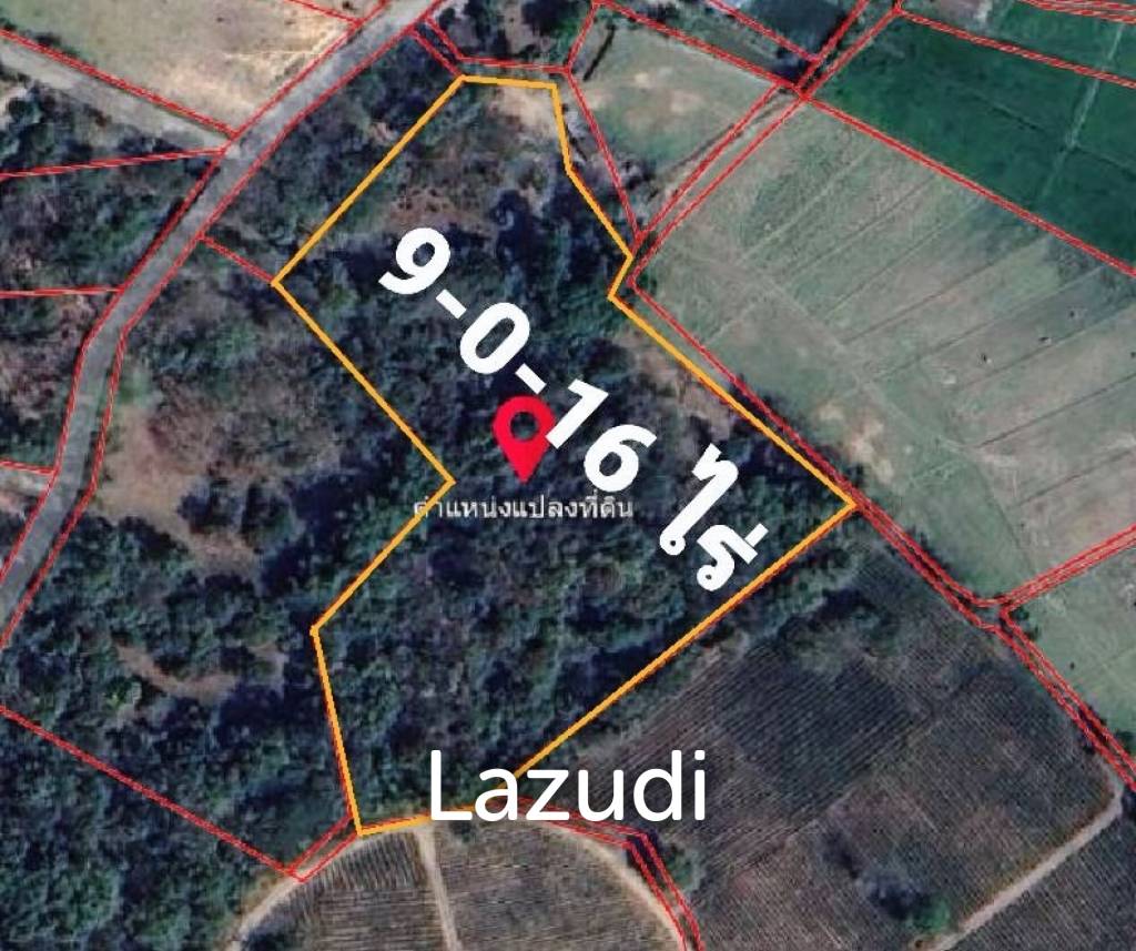 9 Rai Land For Sale on a hillside surrounded by trees.