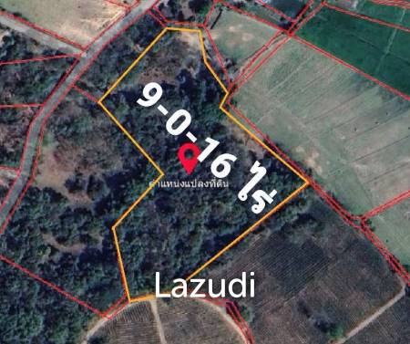 9 Rai Land For Sale on a hillside surrounded by trees.
