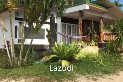 Land with  House and Great Potential Between Srithanu and Thongsala