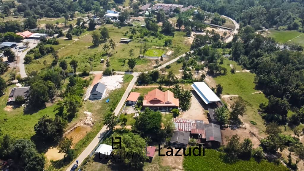 Maison individuelle / terrain de 5000 m² / plusieurs bâtiments