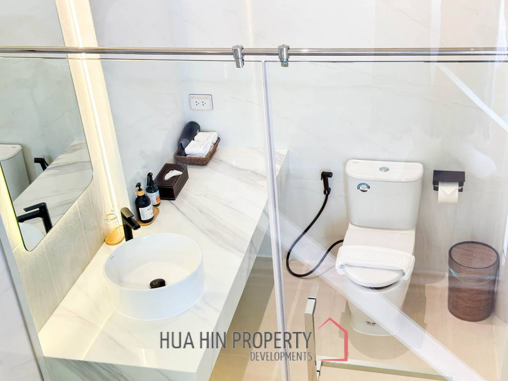 Modern pool villa with slide in Pak Nam Pran