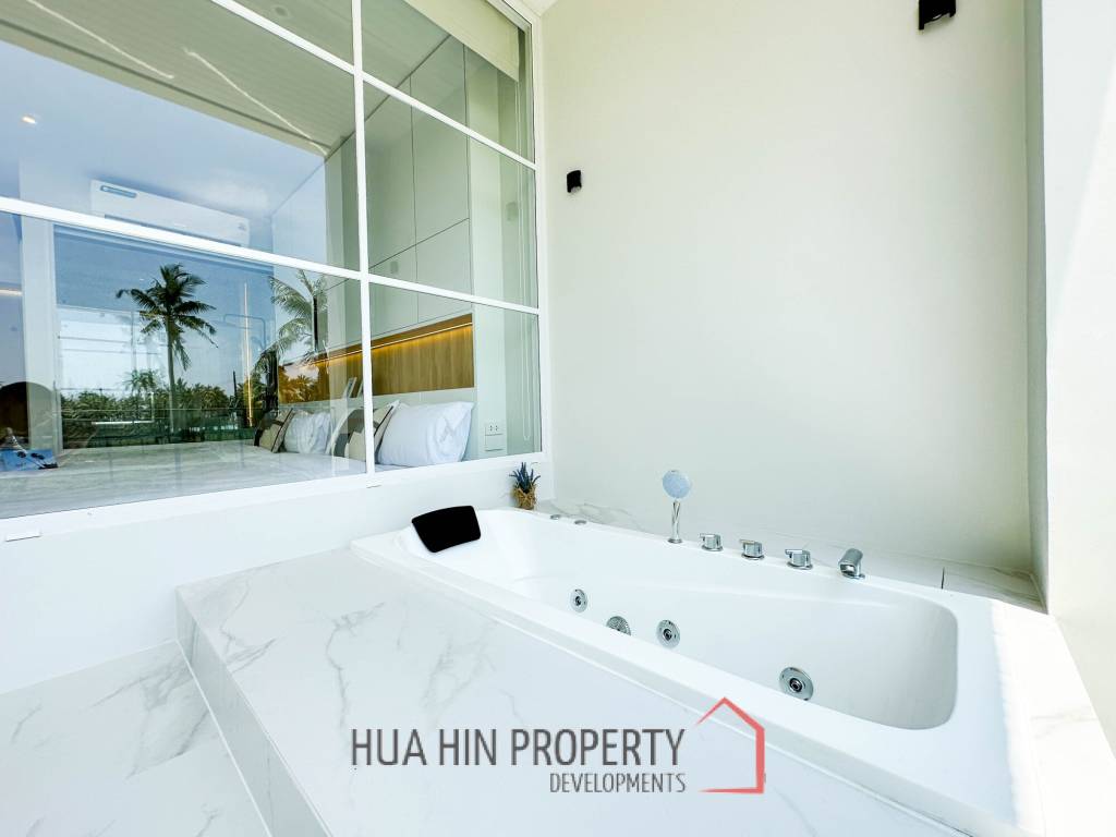 Modern pool villa with slide in Pak Nam Pran