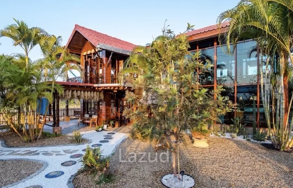 Glass-walled restaurant with gardens in Cha Am
