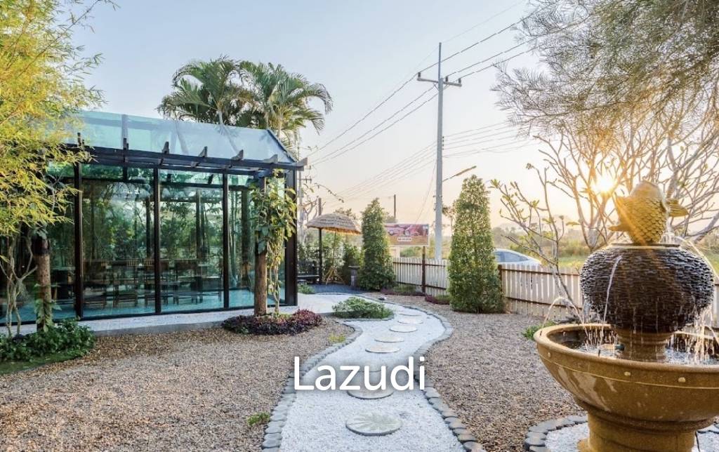 Glass-walled restaurant with gardens in Cha Am