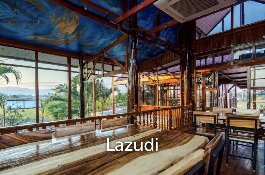 Glass-walled restaurant with gardens in Cha Am