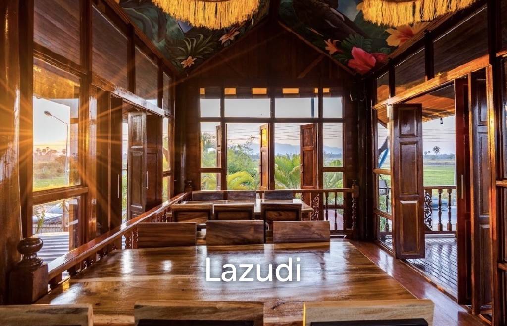 Glass-walled restaurant with gardens in Cha Am