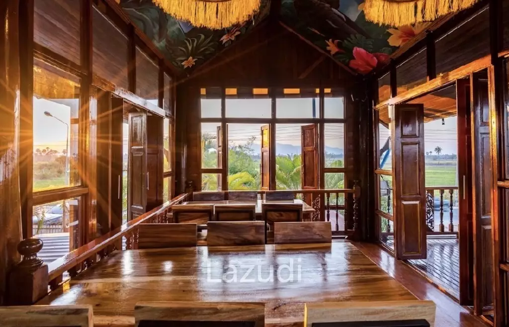 Glass-walled restaurant with gardens in Cha Am