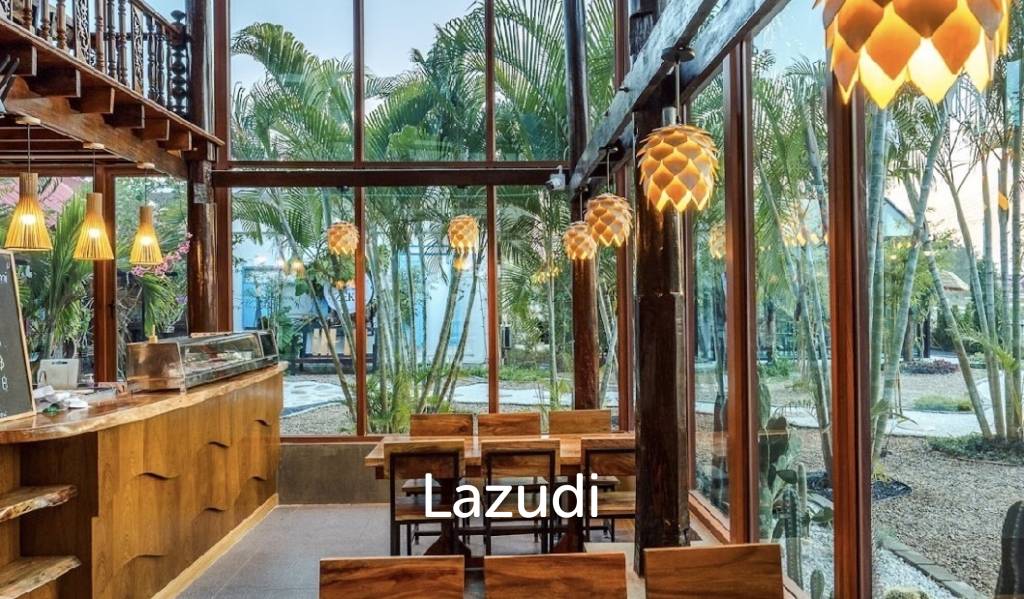 Glass-walled restaurant with gardens in Cha Am