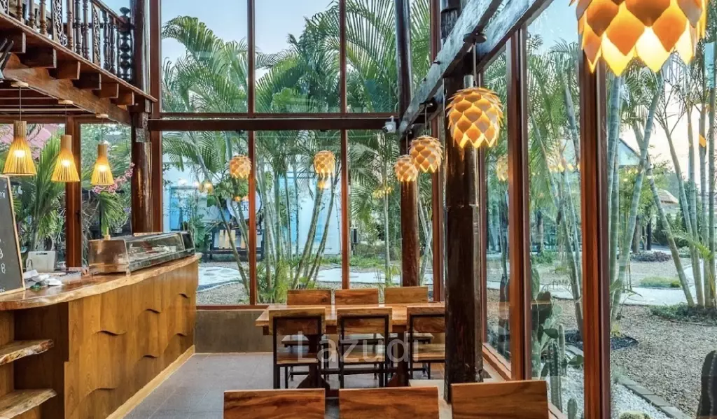 Glass-walled restaurant with gardens in Cha Am