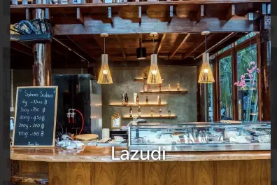 Glass-walled restaurant with gardens in Cha Am