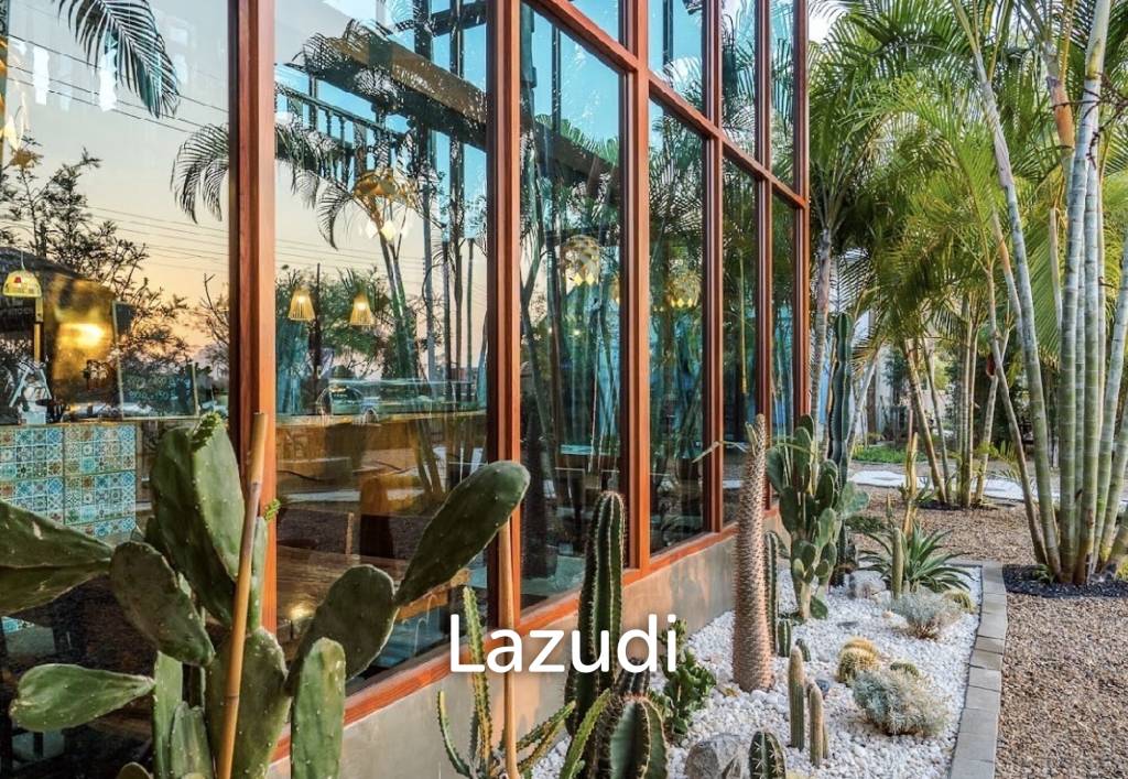 Glass-walled restaurant with gardens in Cha Am