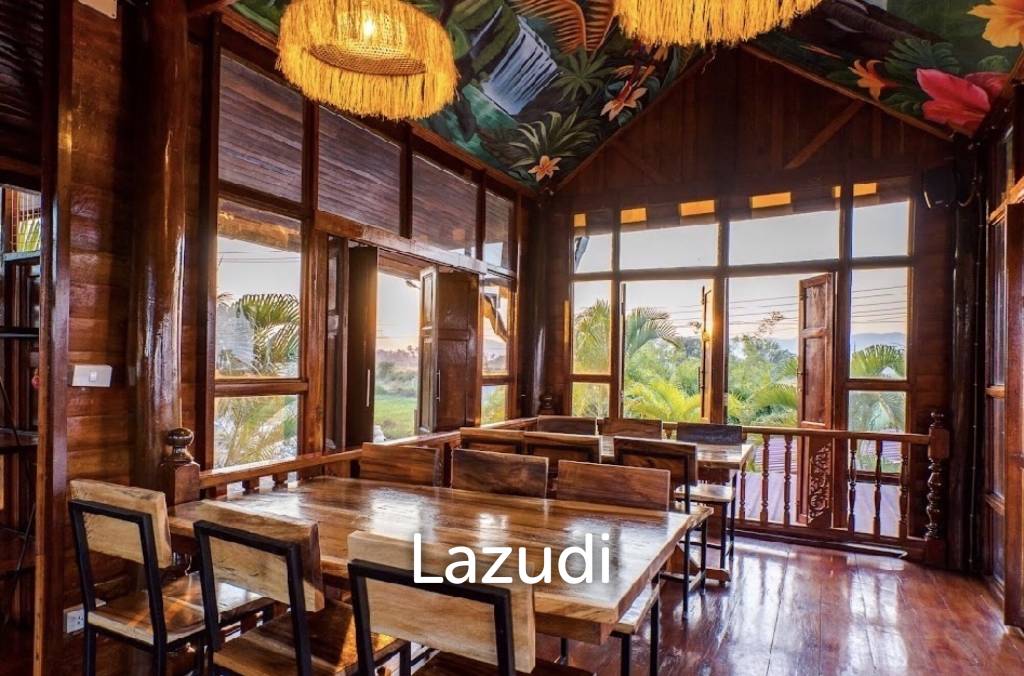 Glass-walled restaurant with gardens in Cha Am