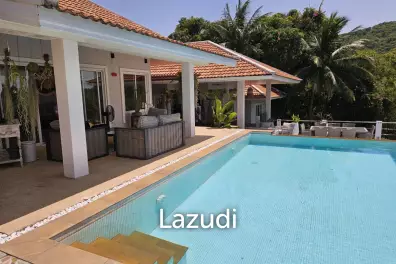 Sea View 4-Bedroom Villa with Expansive Tropical Garden in Prime Bang Rak