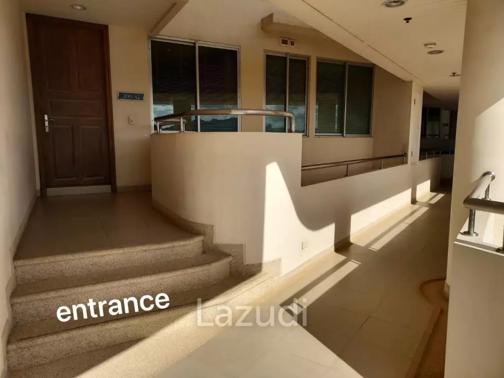 Stunning Beachfront Living: 3-BR Condo with 180° Sea Views
