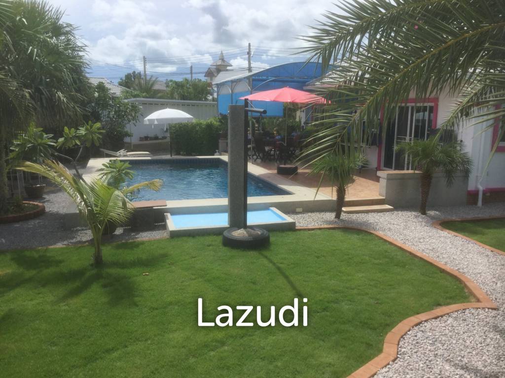 Pool villa on large corner plot set in tropical gardens.