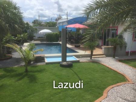 Pool villa on large corner plot set in tropical gardens.