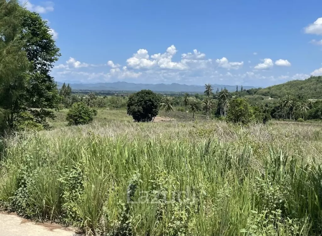 Beautiful elevated land of 15 Rai with great views near Banyan Golf Club.