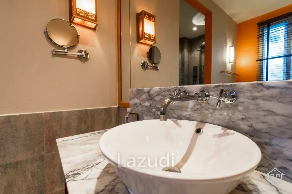 BLUE LAGOON : Immaculately presented 2nd floor 2 bed condo overlooking large swimming pool lagoon.