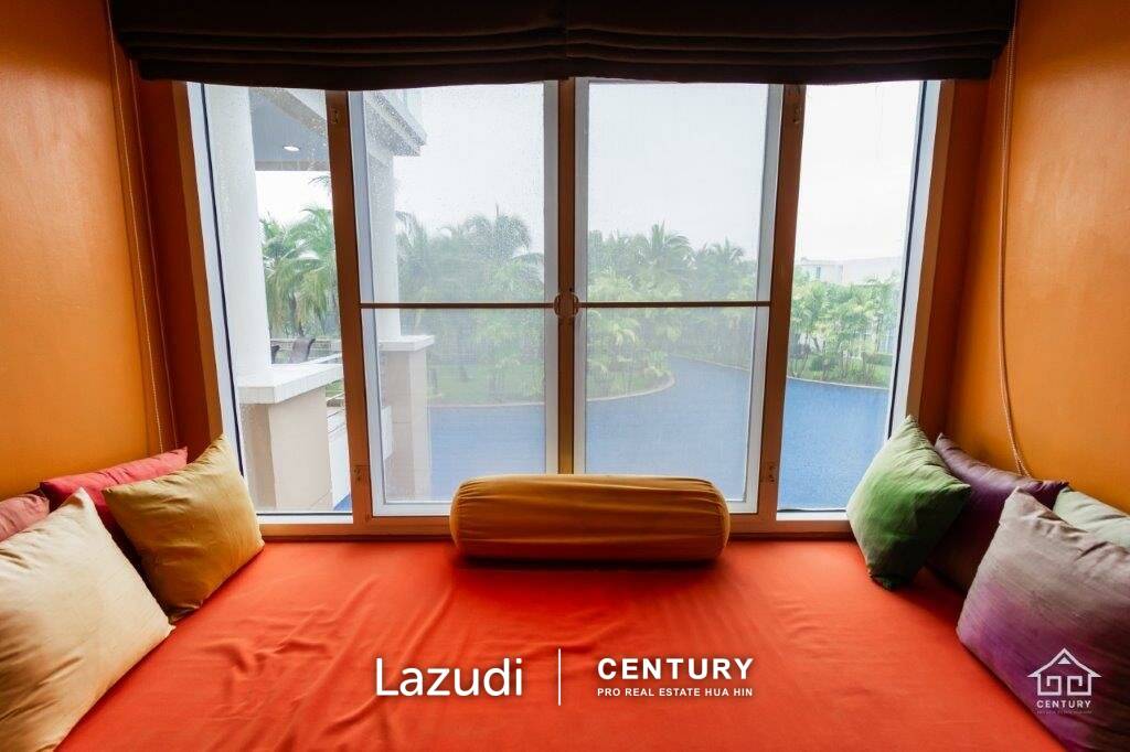 BLUE LAGOON : Immaculately presented 2nd floor 2 bed condo overlooking large swimming pool lagoon.